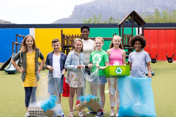 Portrait Happy Diverse Female Teacher Pupils Holding Recycling Collected Schoolyard — Stock Photo, Image