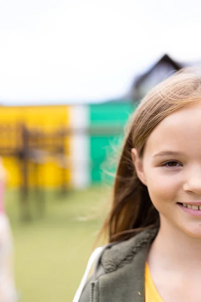 Vertical Half Face Portrait Smiling Caucasian Schoolgirl Schoolyard Copy Space — Stock Photo, Image