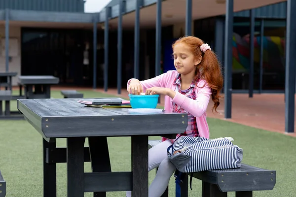 Happy Biracial Schoolgirl Sitting Table Packed Lunch Schoolyard Education Childhood — Stock Photo, Image