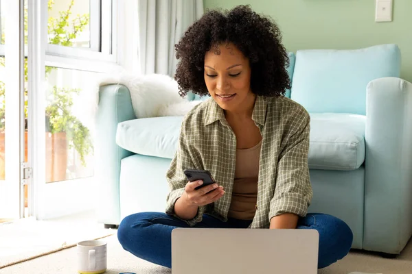 Happy Biracial Woman Using Laptop Smartphone Sitting Floor Bedroom Lifestyle — Stock Photo, Image