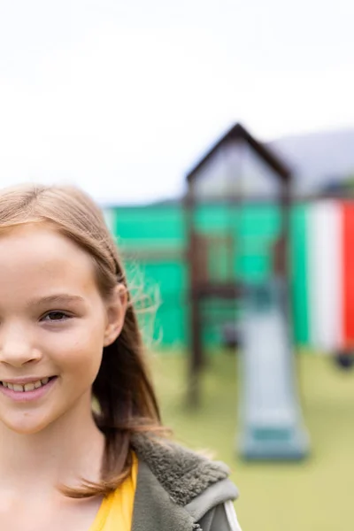 Vertical Half Face Portrait Smiling Caucasian Schoolgirl Schoolyard Copy Space — Stock Photo, Image