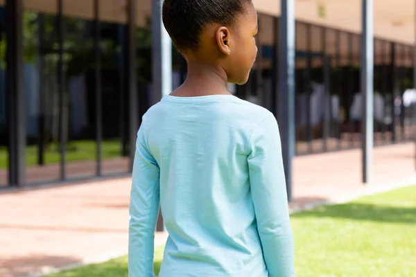 Rear View Biracial Schoolgirl Standing Sunny Schoolyard Education Inclusivity Childhood — Stock Photo, Image
