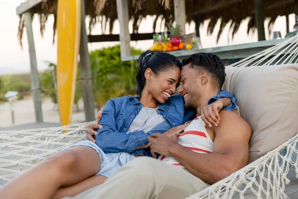 Biracial Cheerful Young Couple Looking Each Other Lying Hammock Beach — Stock Photo, Image