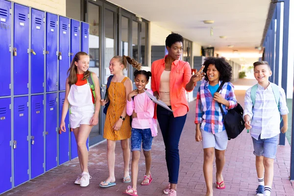 Happy Diverse Female Teacher School Children Walking Together School Corridor — Stock Photo, Image
