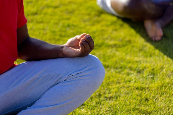 Midsection African American Man Sitting Grass Doing Yoga Meditating Garden — Stock Photo, Image