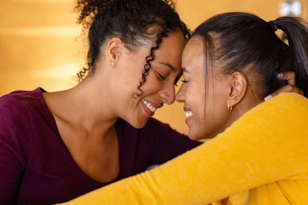 Happy Biracial Lesbian Couple Embracing Smiling Home Lifestyle Relationship Togetherness — Stock Photo, Image