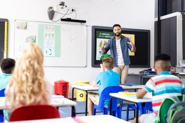 Caucasian Male Teacher Addressing Pupils Diverse Elementary School Classroom Copy — Stock Photo, Image