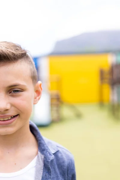 Vertical Half Face Portrait Smiling Caucasian Schoolboy Schoolyard Copy Space — Stock Photo, Image