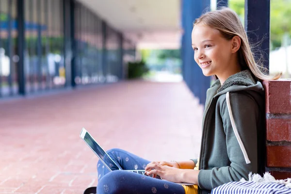 Smiling Caucasian Schoolgirl Using Laptop Sitting School Corridor Copy Space — Stock Photo, Image