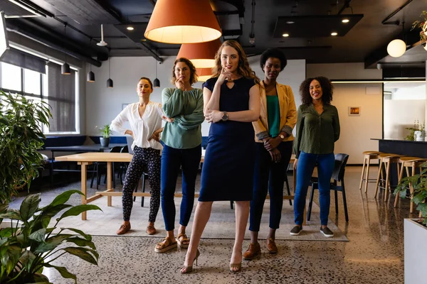 stock image Portrait of diverse female colleagues in casual meeting in office. Casual office, teamwork, business and work, unaltered.