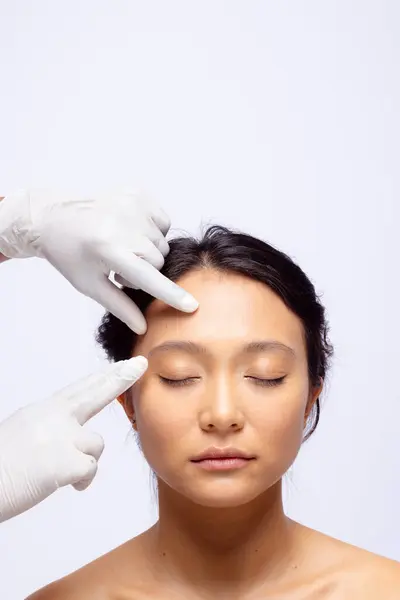 Hands Beautician White Surgical Gloves Touching Face Asian Woman Dark — Stock Photo, Image