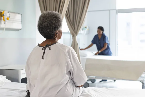 Back African American Senior Female Patient Sitting Bed Sunny Hospital — Stock Photo, Image