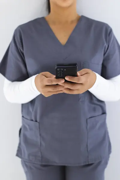 Midsection Biracial Female Doctor Wearing Scrubs Using Smartphon Hospital Medicine — Stock Photo, Image