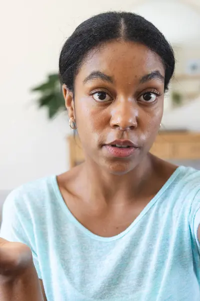 Young Biracial Woman Looks Surprised Home Video Call Her Expression — Stock Photo, Image