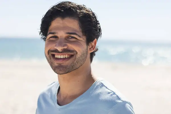 Young Biracial Man Smiles Brightly Outdoors Beach Enjoys Sunny Day — Stock Photo, Image