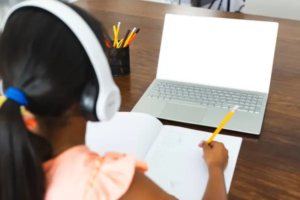 Biracial Girl Studies Home Copy Space She Focused Homework Laptop — Stock Photo, Image