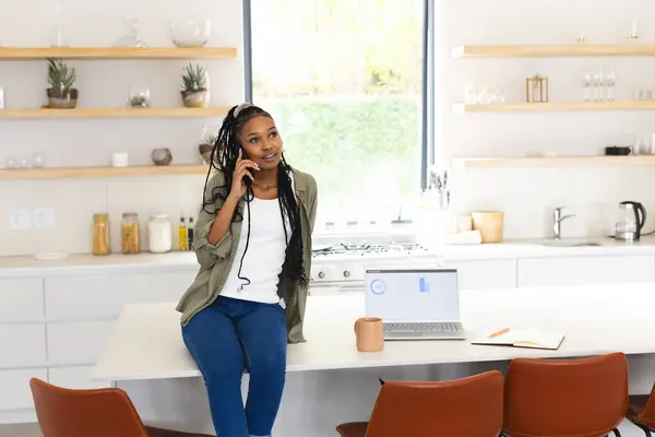Young African American Woman Chats Phone Leaning Kitchen Island Copy — Stock Photo, Image
