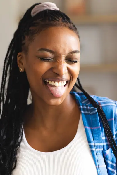Young African American Woman Laughs Joyfully Sticking Out Her Tongue — Stock Photo, Image