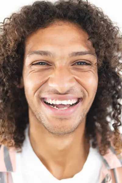 Young Biracial Man Curly Hair Smiles Broadly Showcasing Joy His — Stock Photo, Image