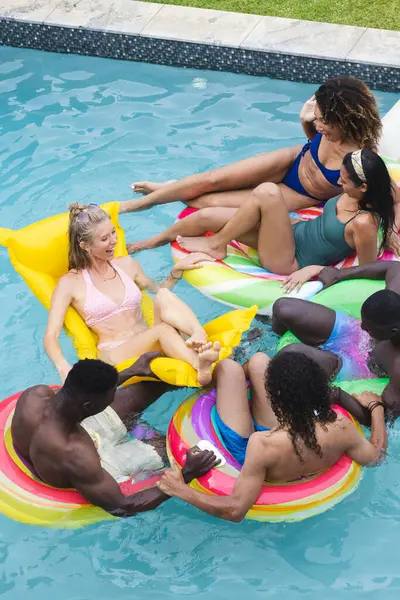 Diverse Group Friends Enjoy Pool Party Lounging Colorful Floaties Young — Stock Photo, Image