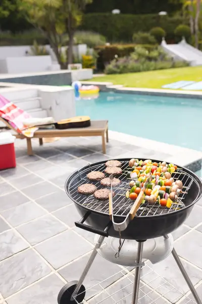Charcoal Grill Cooking Burgers Vegetable Skewers Poolside Copy Space Setting — Stock Photo, Image