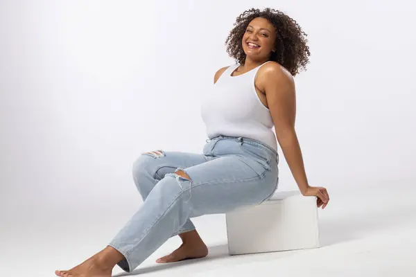 Biracial Size Model Sits Smiling White Background Copy Space She Royalty Free Stock Photos