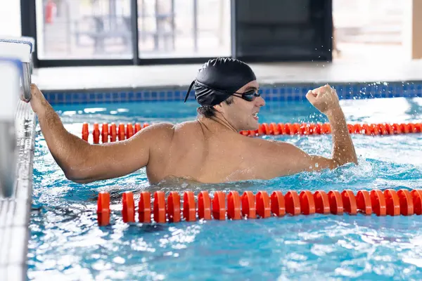 Caucasian Young Male Swimmer Dark Hair Training Indoors Pool Wearing Royaltyfria Stockfoton