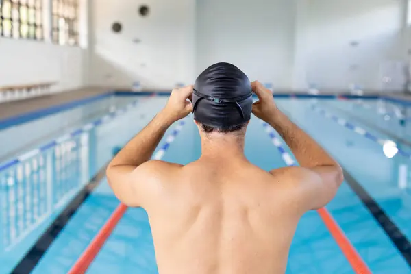 Caucasian Young Male Swimmer Adjusting Black Swim Cap Standing Pool Foto Stock Royalty Free