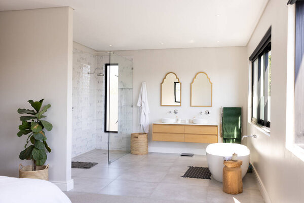 Modern bathroom with double sinks, glass shower, and freestanding bathtub, copy space. Interior design, luxury, minimalism, home decor, architecture, contemporary, unaltered — Stock Image Modern Bathroom Double Sinks Glass Shower Freestanding Bathtub Copy Space Royalty Free Stock Photos