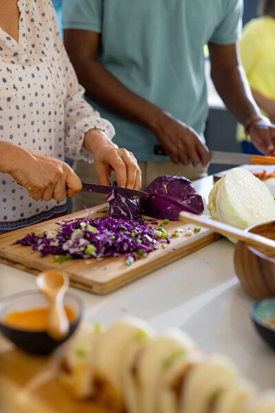 Home Chopping Purple Cabbage Senior Friends Preparing Meal Together Kitchen Stock Picture