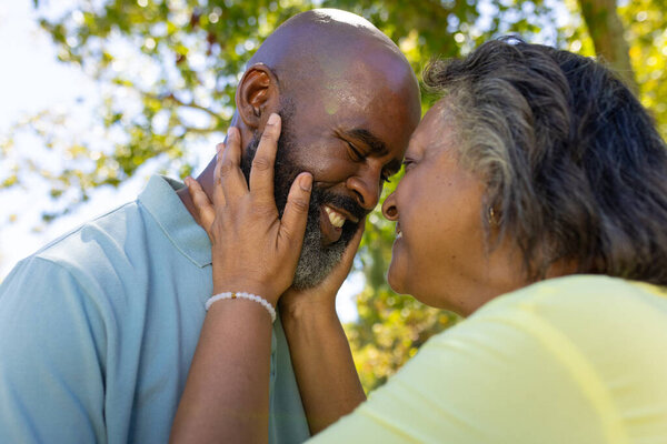 Embracing and smiling, senior couple enjoying tender moment outdoors. Seniors, togetherness, happiness, lifestyle, bonding, unaltered — Stock Image Embracing Smiling Senior Couple Enjoying Tender Moment Outdoors Seniors Togetherness Stock Image