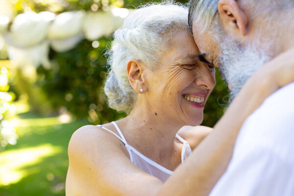 Embracing outdoors, smiling senior bride and groom at wedding. Elderly, happiness, relationship, love, togetherness, retirement — Stock Image Embracing Outdoors Smiling Senior Bride Groom Wedding Elderly Happiness Relationship Royalty Free Stock Images