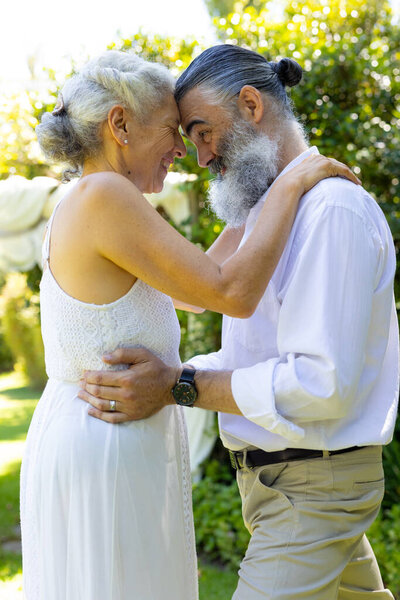 Senior bride and groom embracing and smiling outdoors, at wedding. Elderly, love, relationship, happiness, affectionate, romance — Stock Image Senior Bride Groom Embracing Smiling Outdoors Wedding Elderly Love Relationship Royalty Free Stock Photos