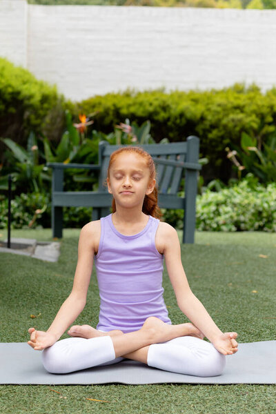 Vertical Happy Biracial Girl Sitting Garden Practicing Yoga Meditation Copy Stock Photo