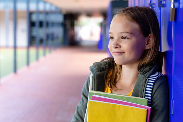 Smiling Caucasian Schoolgirl Holding Books Lockers School Corridor Copy Space Stock Image