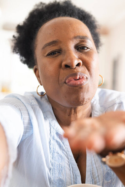 Portrait of happy senior african american woman having video call at home. Domestic life, retirement, technology and lifestyle, unaltered. — Stock Image Portrait Happy Senior African American Woman Having Video Call Home Stock Image