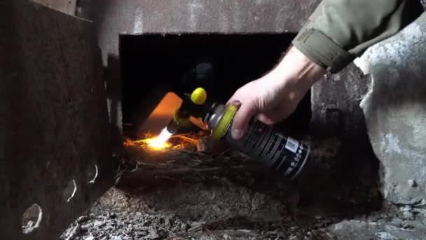 Guy Lights Fire Oven Lay Firewood Old Stove Abandoned Hut — Stockvideo
