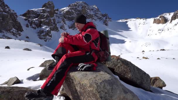Climber Injured His Leg Mountains Massages Knee Beautiful Landscape Snowy — Stock Video