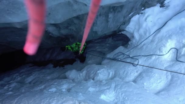 Climber Descends Safety Rope Ice Cave Glacier Gray Blue Color — стоковое видео