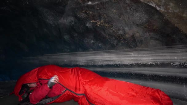 Guy Goes Sleep Sleeping Bag Ice Cave Preparing Bed Red — стоковое видео
