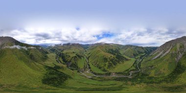 360 panorama of a mountainous area from a height. Drone view of green meadows and hills, with coniferous trees in places. A river runs through the forest. White clouds and blue sky. Beautiful gorge. clipart