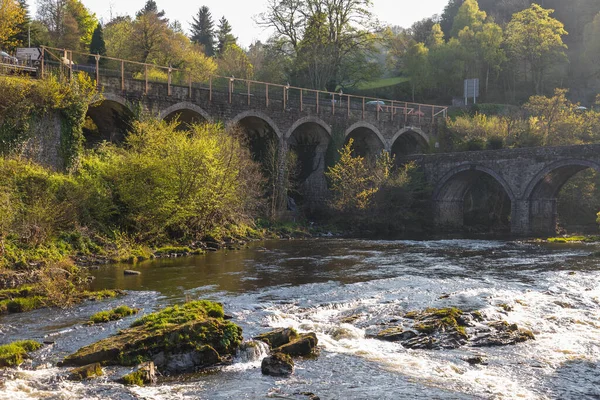 stock image Bridge over the Dee river near the Horseshoe Falls near Llangollen. Llangollen, Denbighshire, Wales.