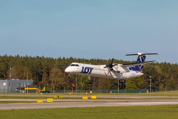 stock image POLAND, GDANSK - 12 May, 2019: Aircraft line LOT landing at the airport runway. The Lech Walesa Airport in Gdansk.