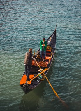 October 30, 2022 - Venice, Italy: People taking photos while riding a gondola in Venice. Tourism concept.