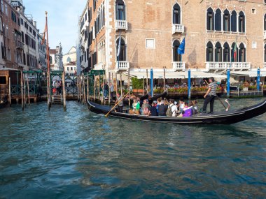 October 31, 2023 - Venice, Italy: Group of tourists on a gondola in the grand canal in Venice. Tourism concept.