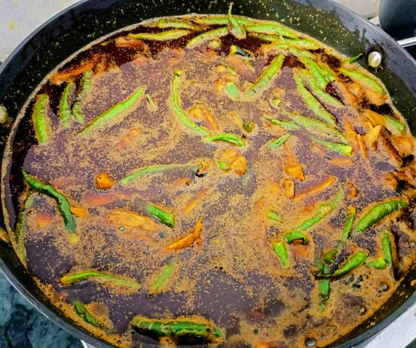 A closeup of making mixed pickle at home in India