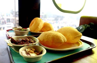 Chole bhature is a famous North Indian food dish. A combination of chana masala and bhatura or puri clipart