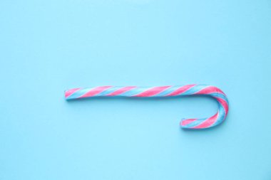 Mavi arka planda şeker kamışı. Mutlu Noeller.. .