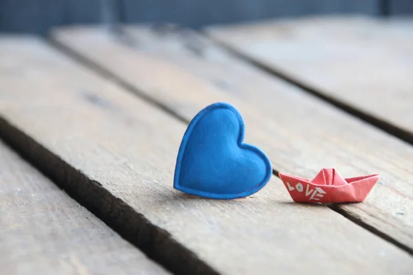 Birthday background. Blue heart on a wooden background. Place for text. Valentines card.