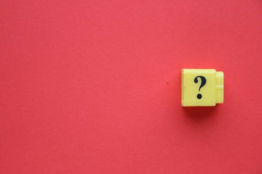 Large question mark on a red background..